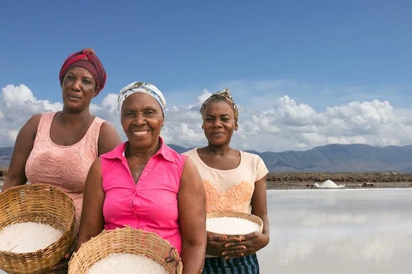 Women at a salt production site in AMURT Haiti's community enterprise work