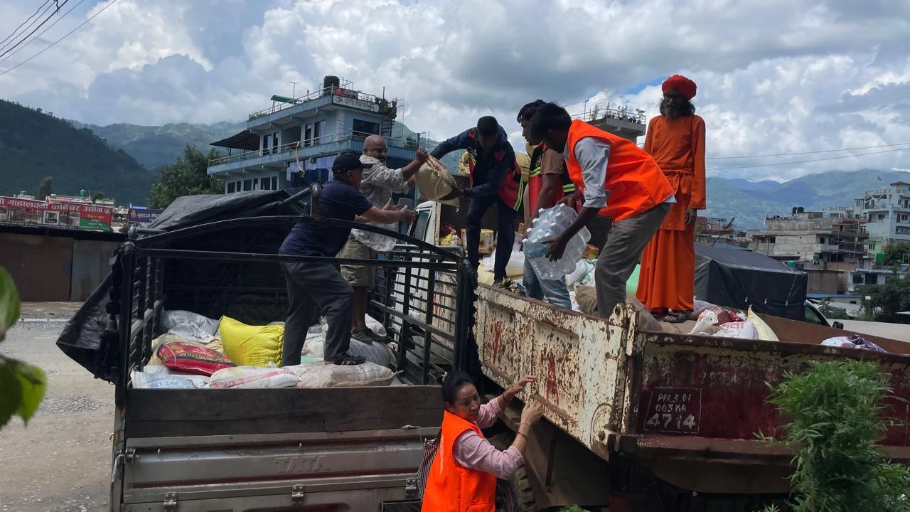 AMURT volunteers loading a truck with emergency relief supplies in Nepal